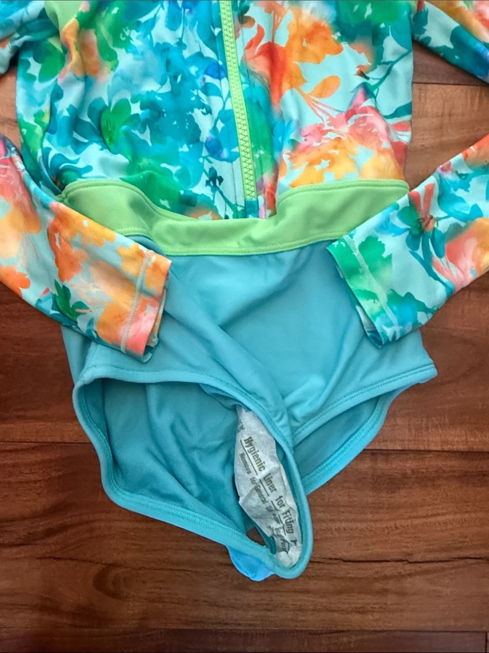 NWOT Athleta Girl Floral Aqua and Orange Long-Sleeve One-Piece Rash Guard